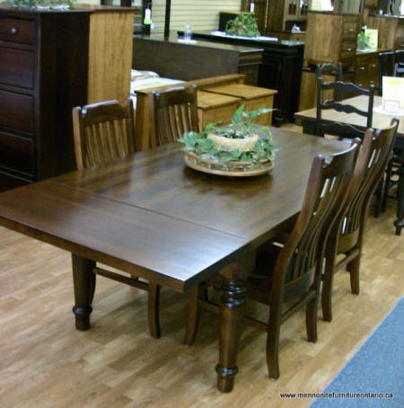 Wormy Maple table 42 x 72 with 18 inch end extensions, 1  top shown with 4  turn leg. Comes with 6 contour mission chairs. Other chairs available, various stains.